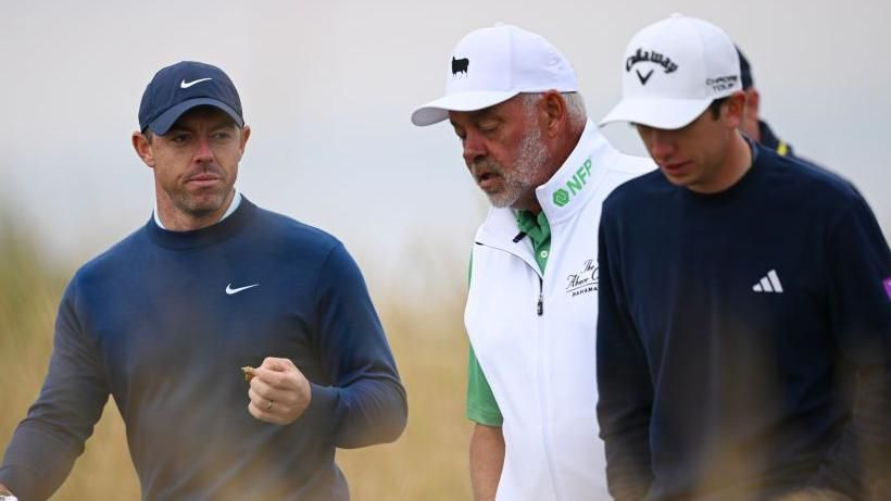 Rory McIlroy, Darren Clarke and Tom McKibbin pictured during their practice round at Royal Troon