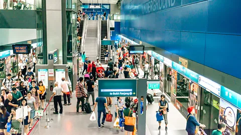 Alamy Commuters in Singapore benefit from contactless payments and real-time data (Credit: Alamy)