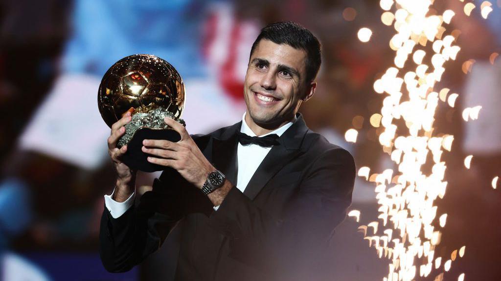 Rodri celebrates with the Ballon d'Or 