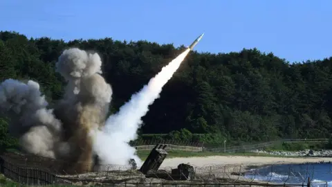 Getty Images An Army Tactical Missile being launched on a beach.