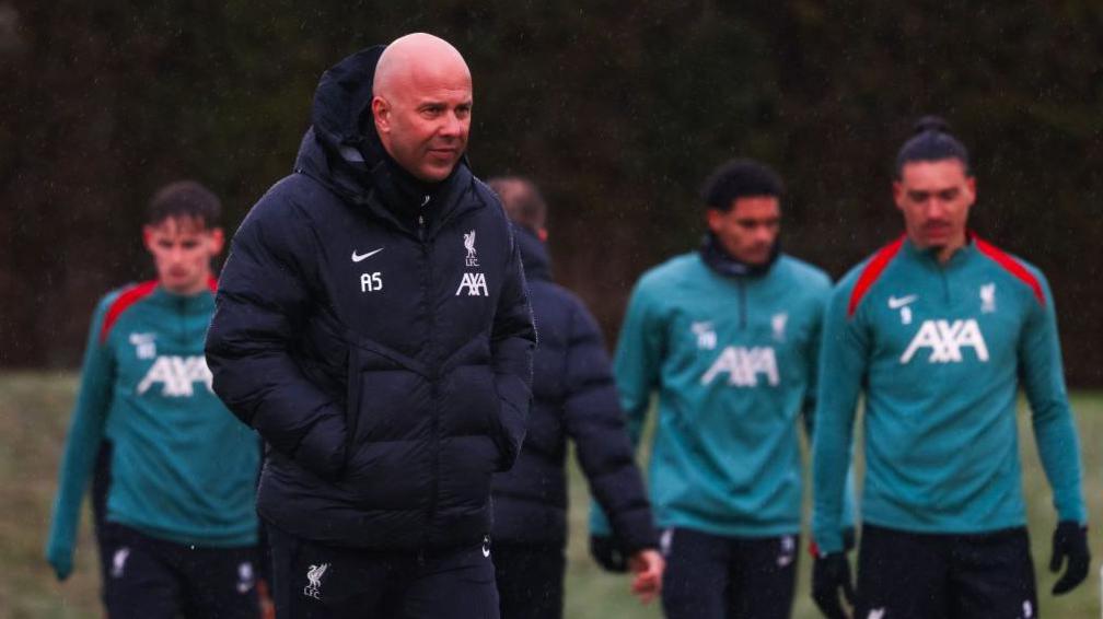 Arne Slot leads his players during training