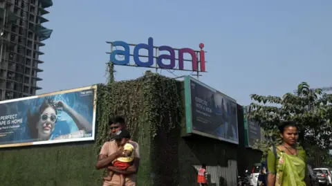 Getty Images Signage for Adani Group at the construction site of an Adani Realty residential project in Mumbai, India, on Thursday, Nov. 21, 2024. 